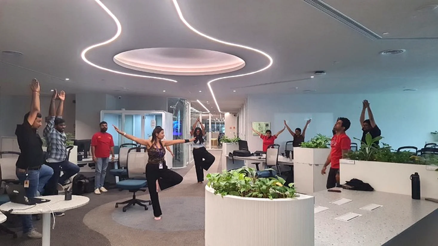 Poonam leading chair yoga in a corporate office